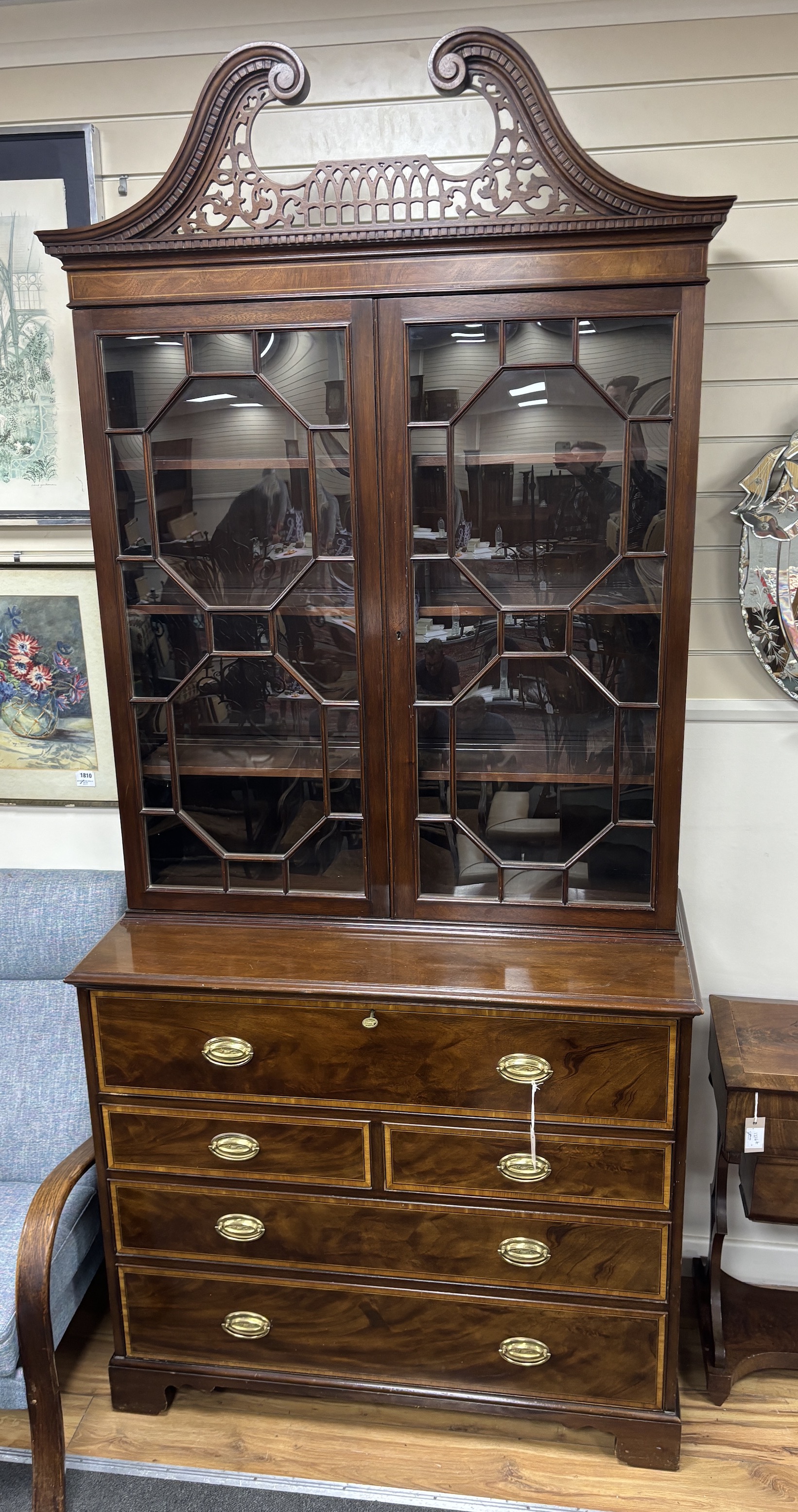 A George III style satinwood banded mahogany secretaire bookcase, width 109cm, depth 50cm, height 240cm